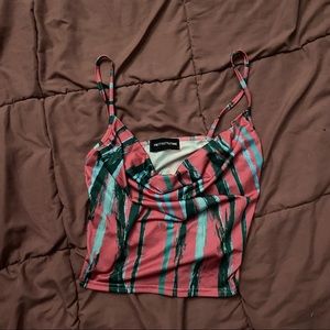 Crop top Pink &’ green pretty little thing , drop low in the front
